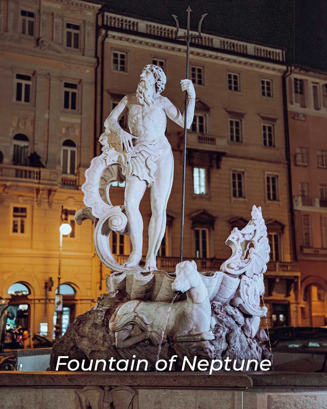 Statue of Neptune in Trieste holding a trident, representing the Roman god of the se