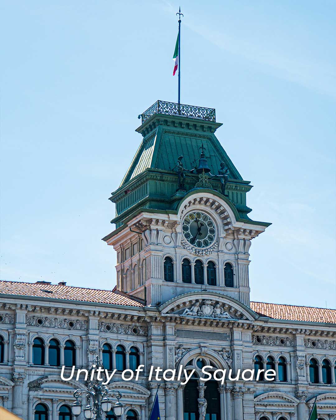 Clock on the facade of a historic building at Piazza Unità d’Italia in Trieste