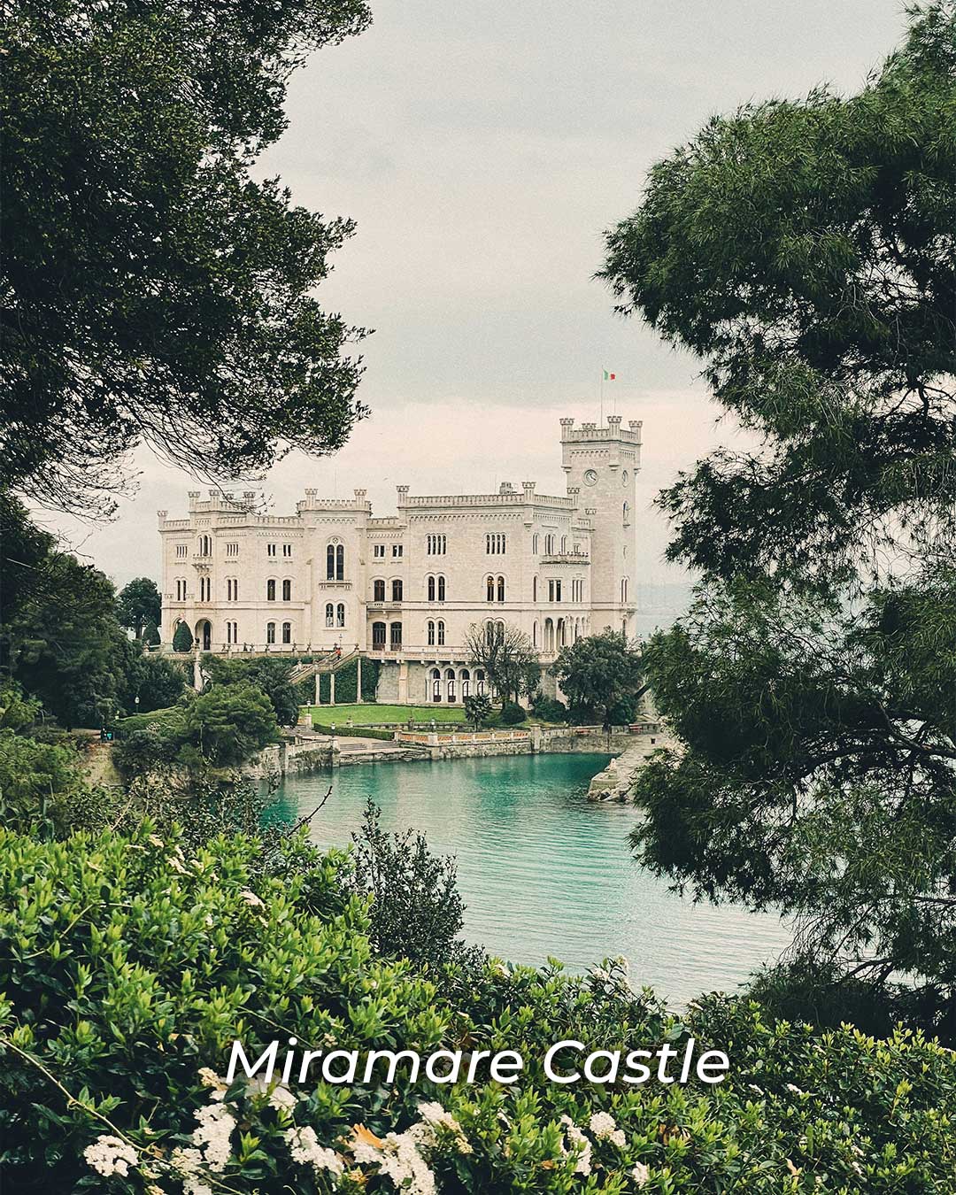 Miramare Castle near Trieste, a 19th-century seaside fortress with white stone walls overlooking the Adriatic